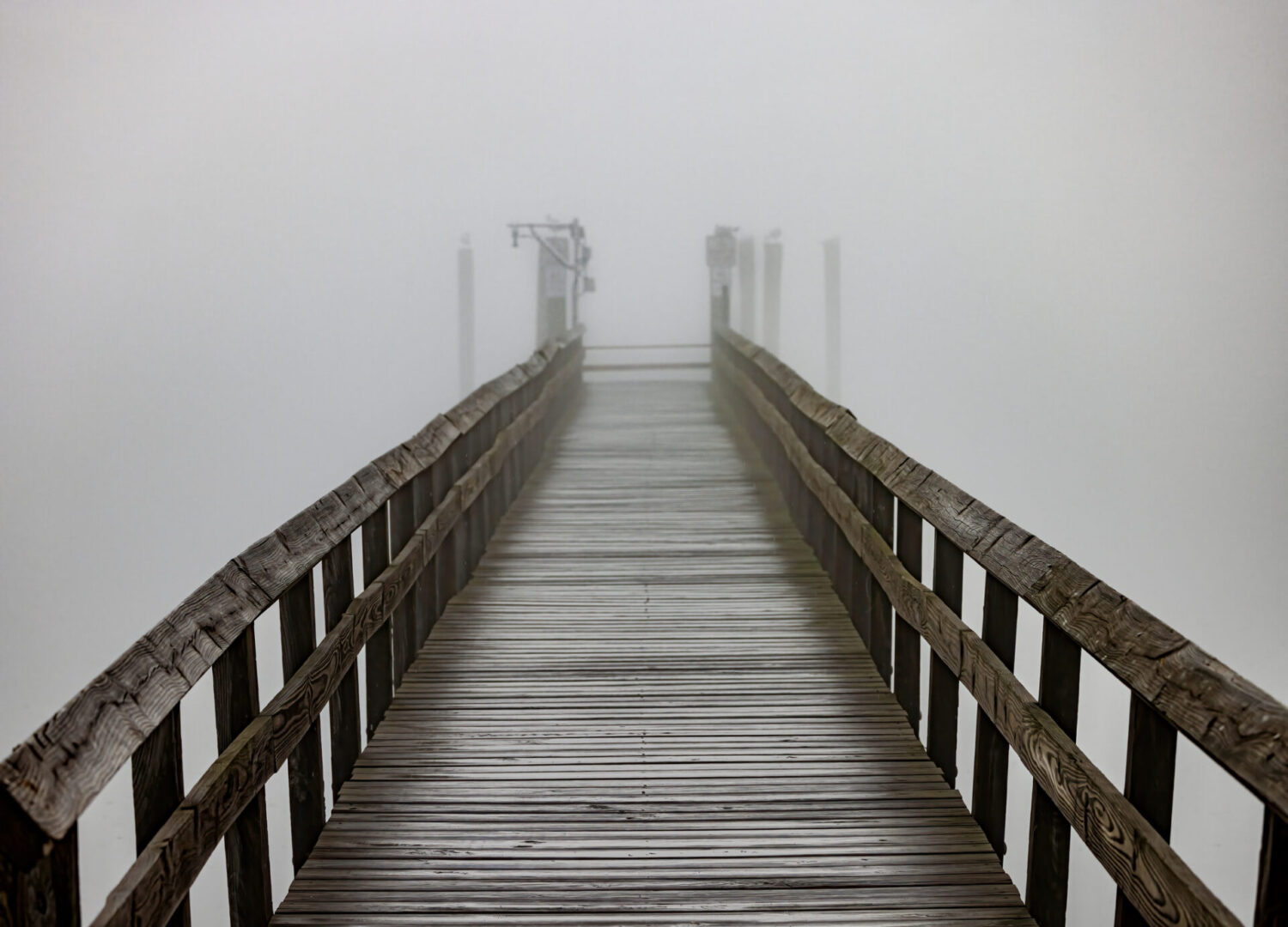 Fog rolling in over the pier